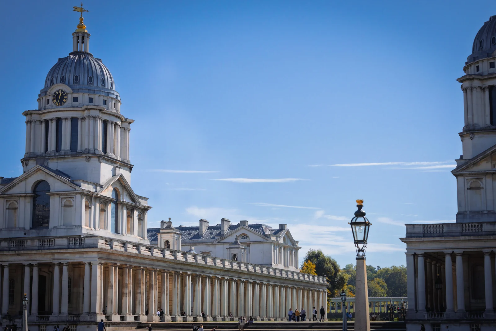 The Old Royal Naval College buildings under a clear sky.
