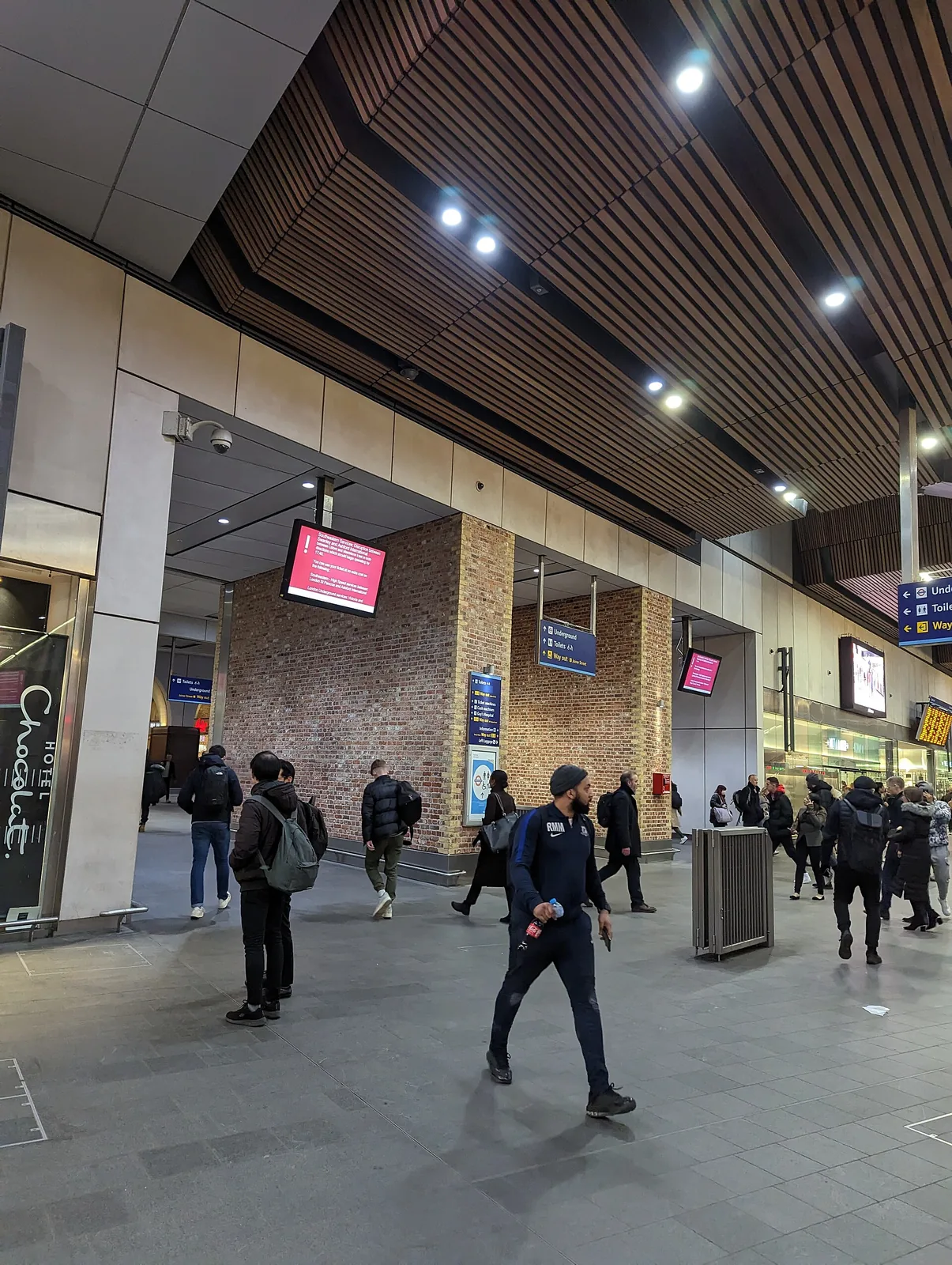 Travellers beneath the timber-lined ceiling of London Bridge station&rsquo;s concourse, near Underground passages